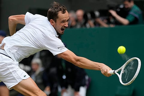 Daniil Medvedev return the ball to Carlos Alcaraz